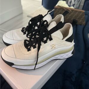 CHANEL White and Black Sneakers with Gold Accent